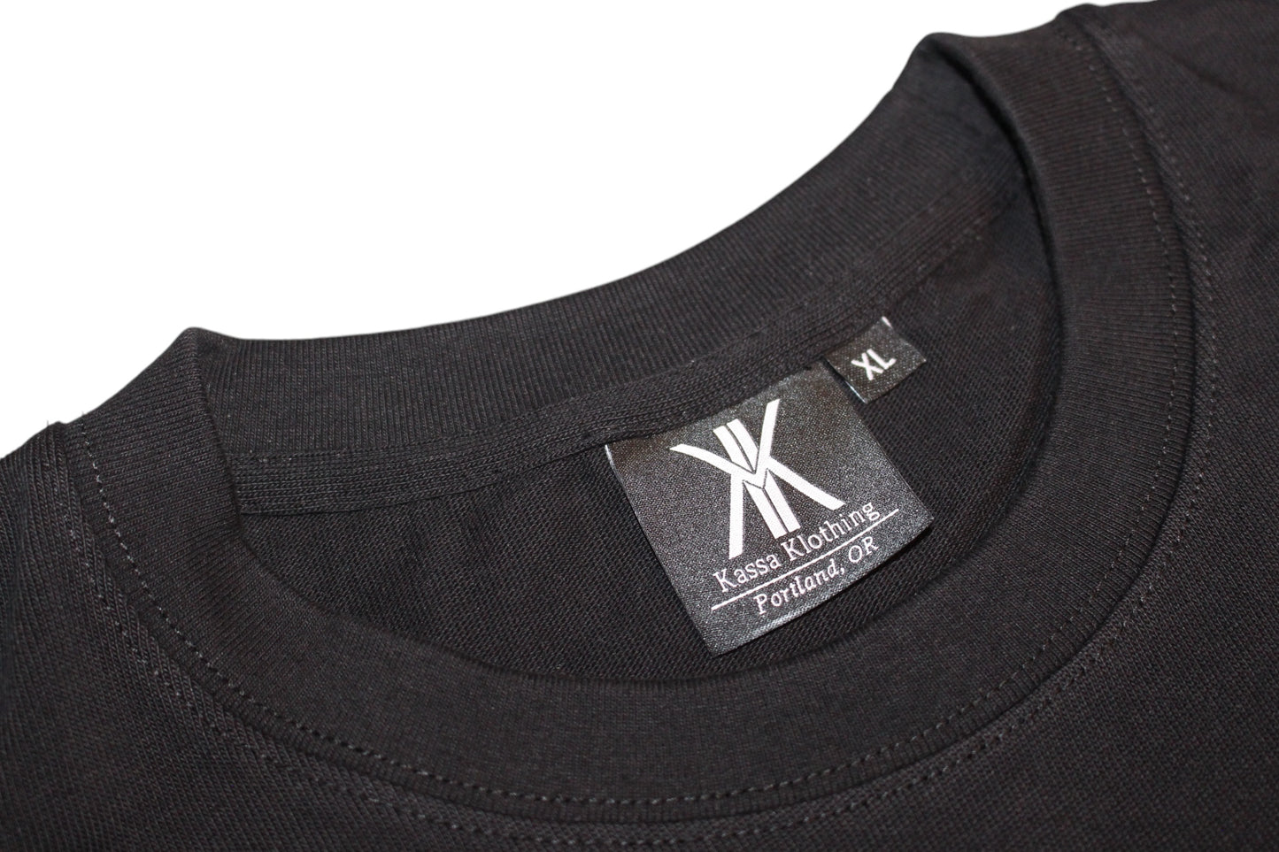 Black T-shirt, with black lettering and white logo